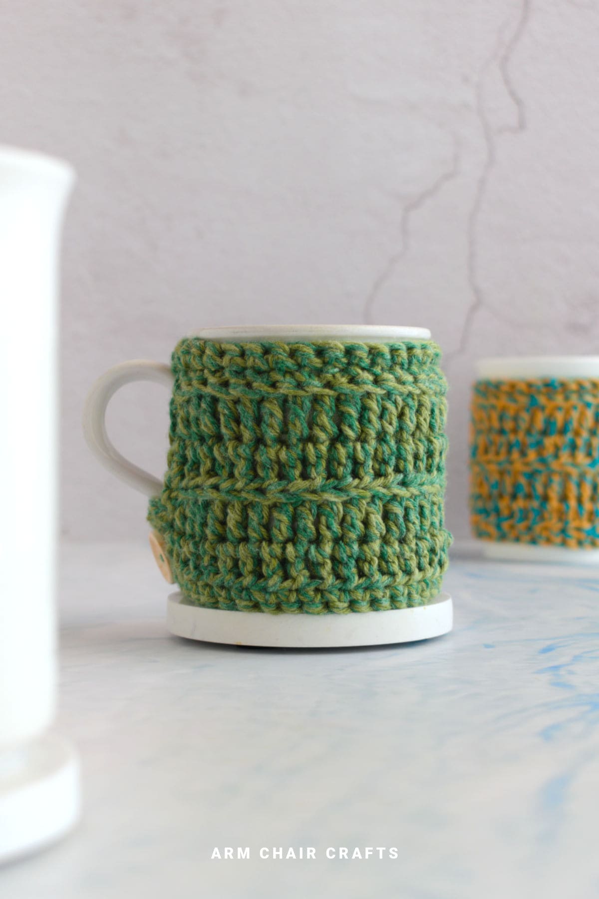 Crochet mug cozy on a mug.