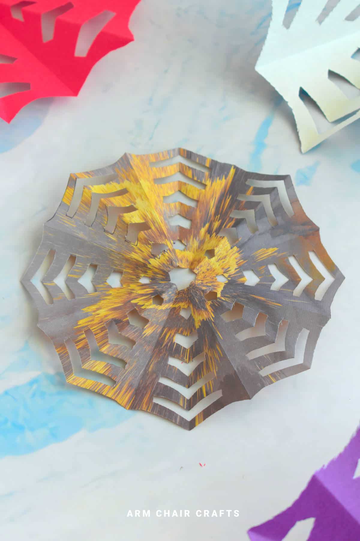 Black and gold paper spiderweb.