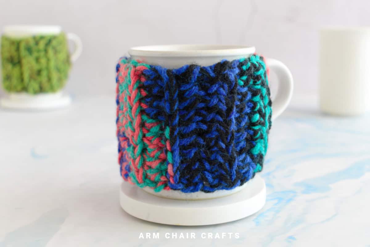 Close up image of a mug cozy.