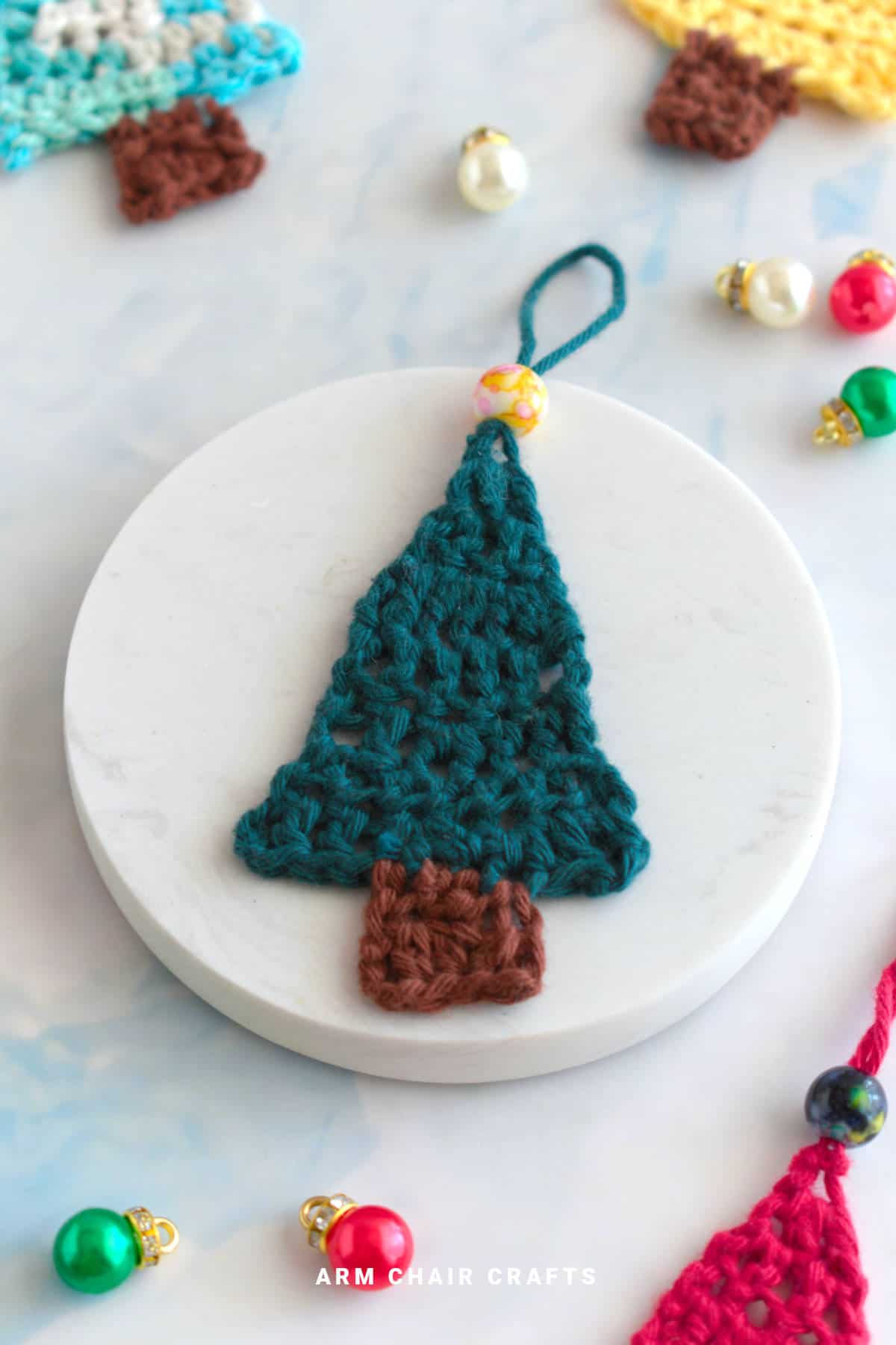 Close up image of a crochet Christmas tree