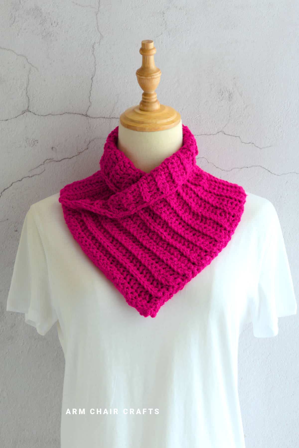 Crochet cowl on a mannequin.