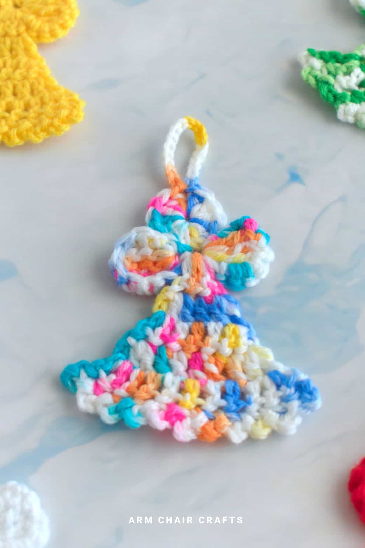 Close up image of a crochet angel.