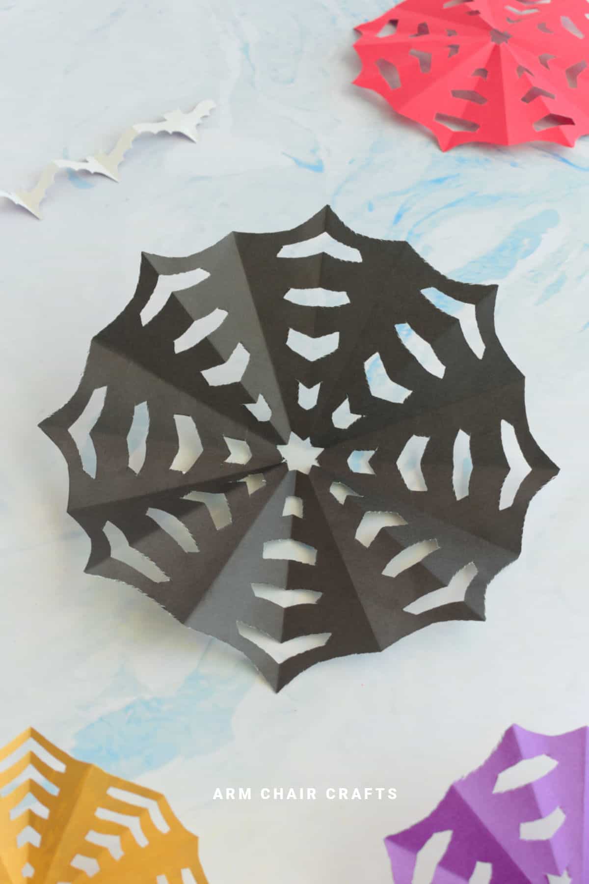 Black paper spiderweb.