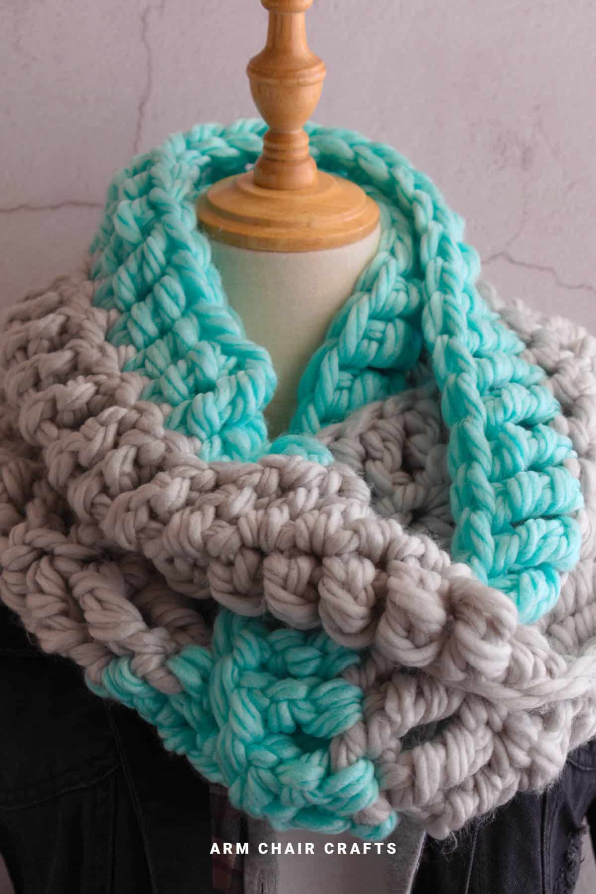 Close up image of a chunky crochet scarf.