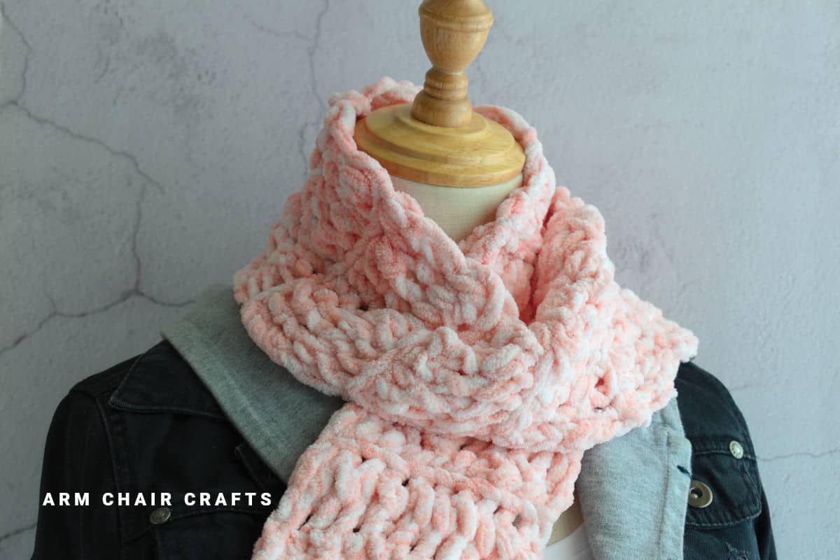 Pink crochet scarf.