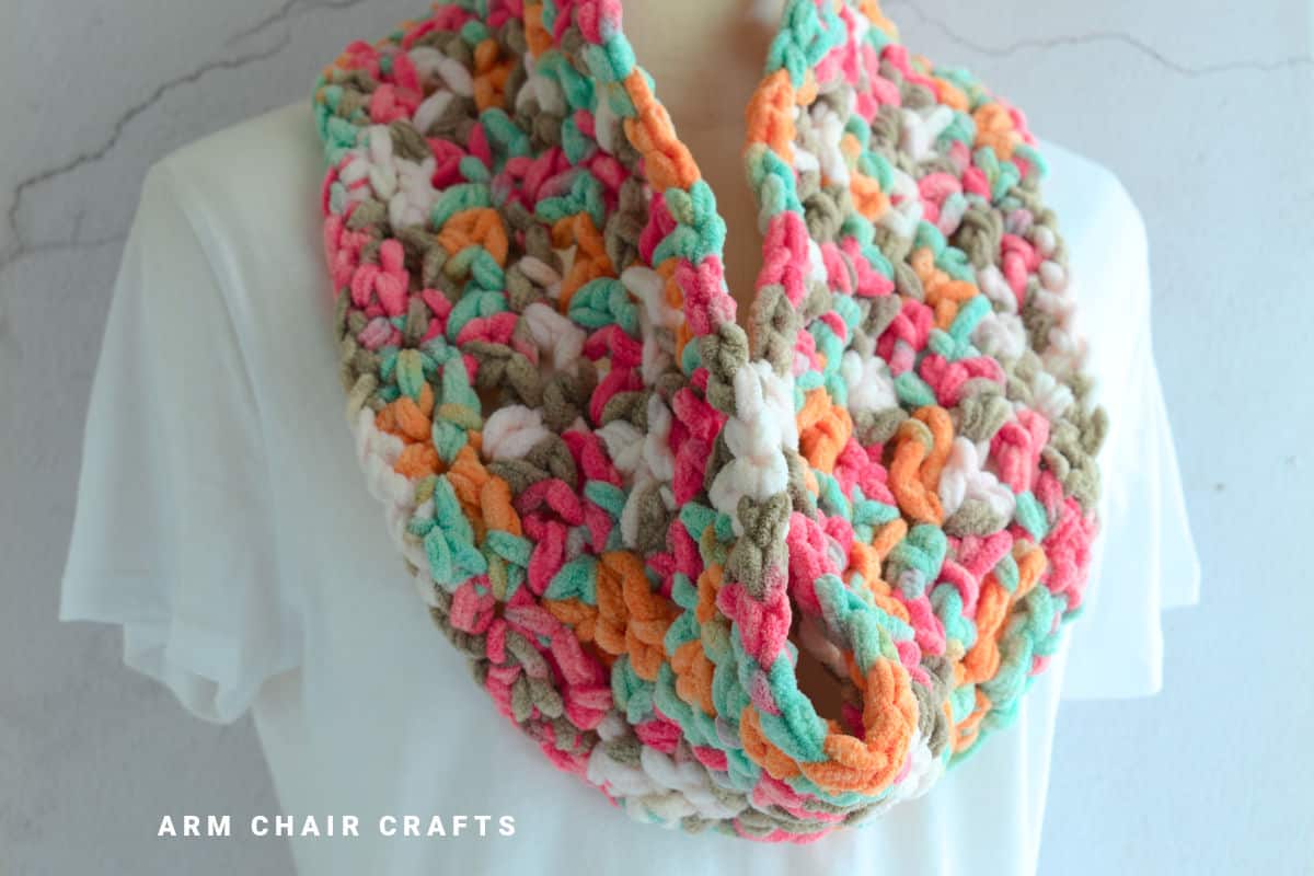 Close up image of a cosy crochet cowl.