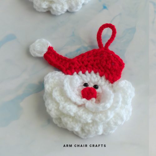 Close up image of a crochet Santa.