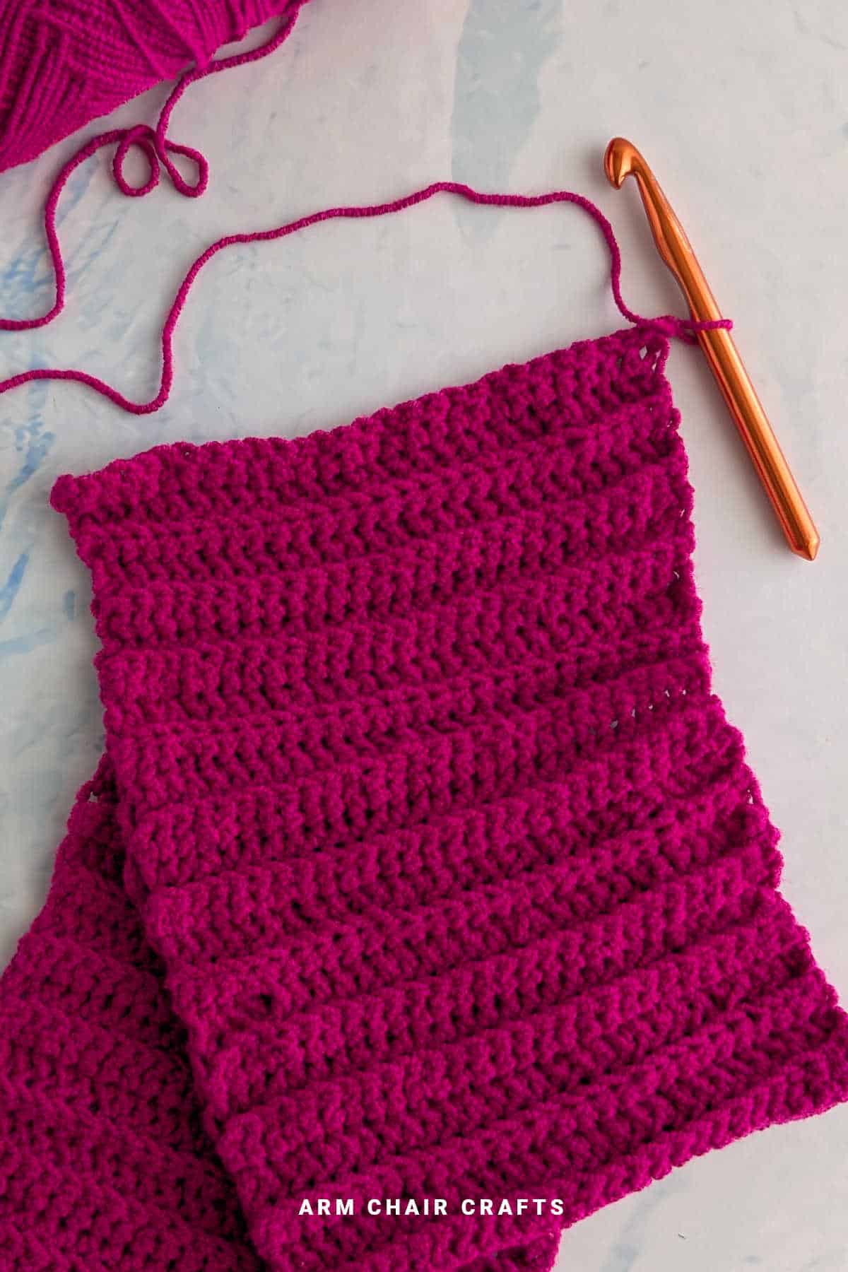 Close up image of a crochet cowl.