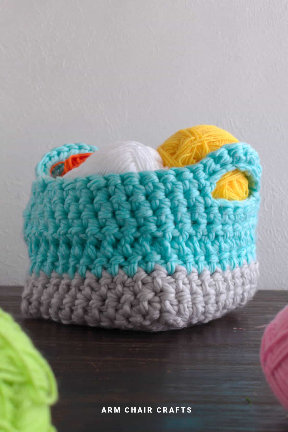 Chunky crochet basket with handles.