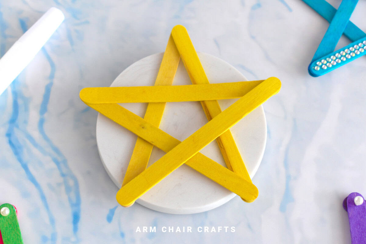 Yellow popsicle wooden star.