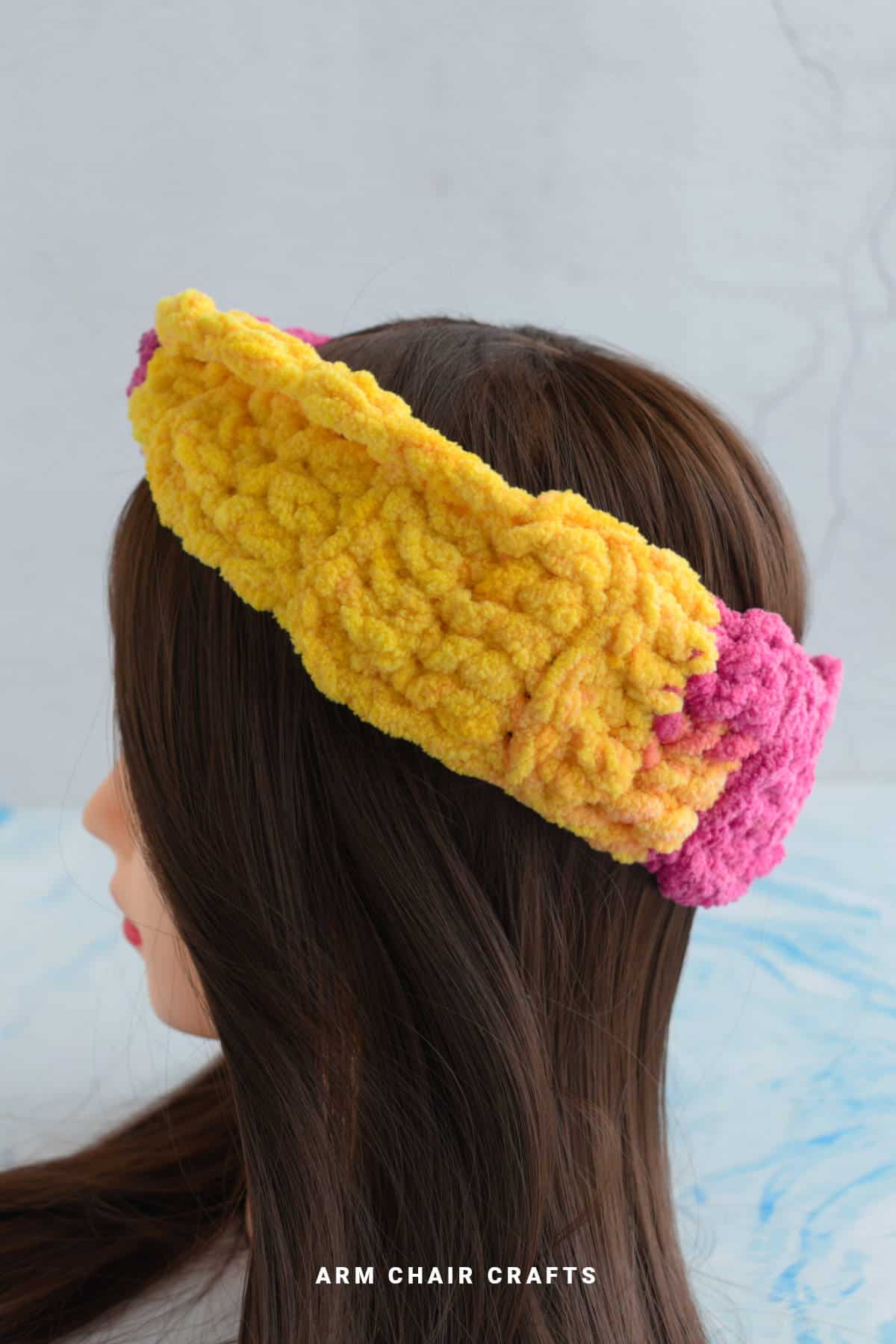 Yellow and pink crochet headband.