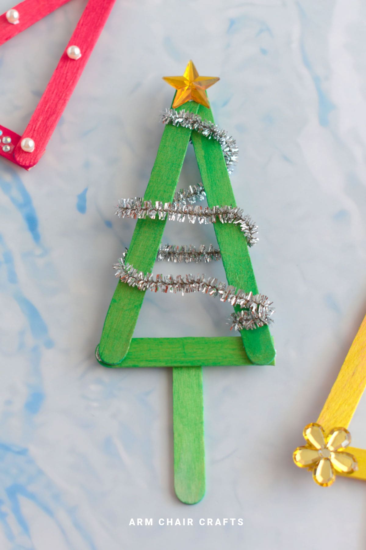 Green popsicle Christmas tree ornament.