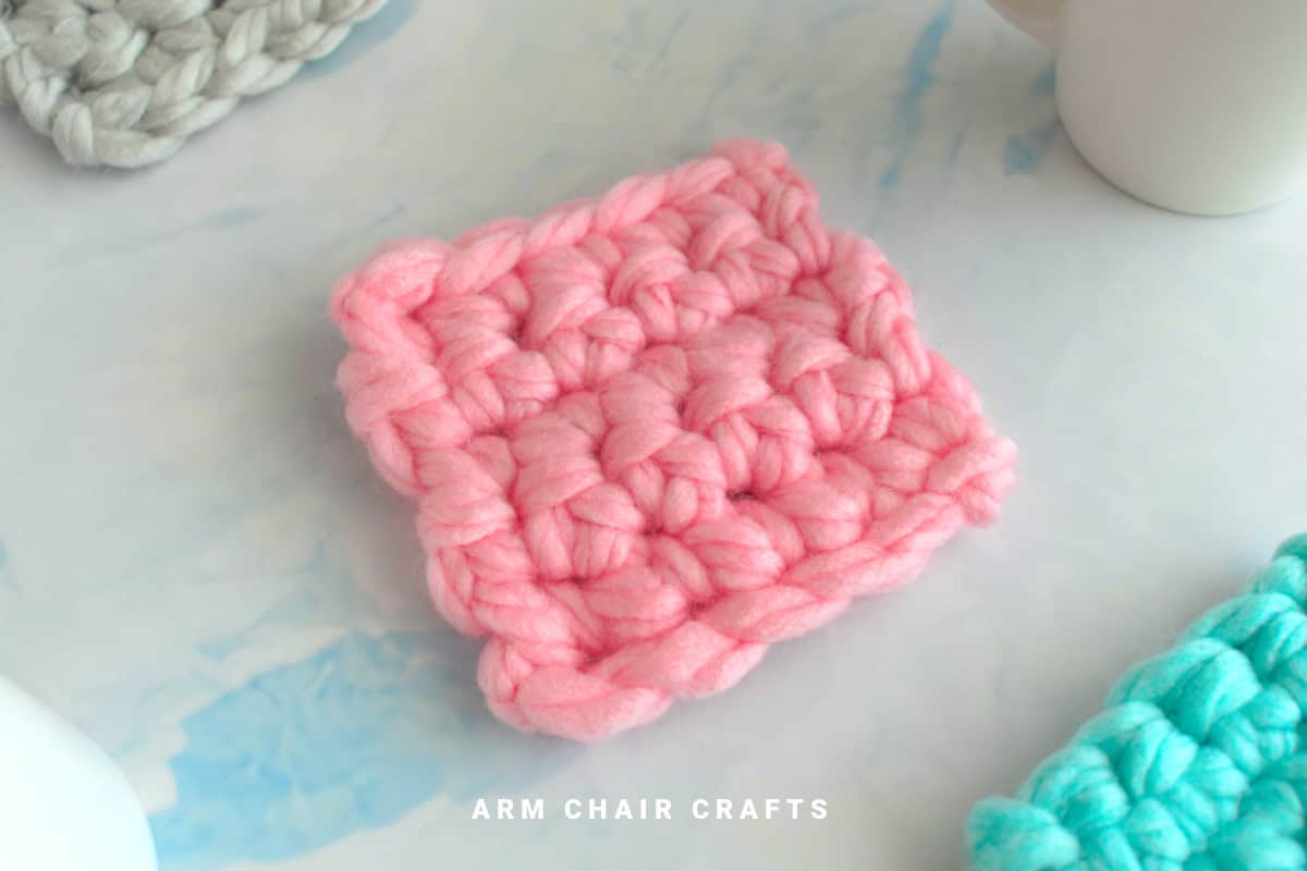 Close up image of a crochet coaster.