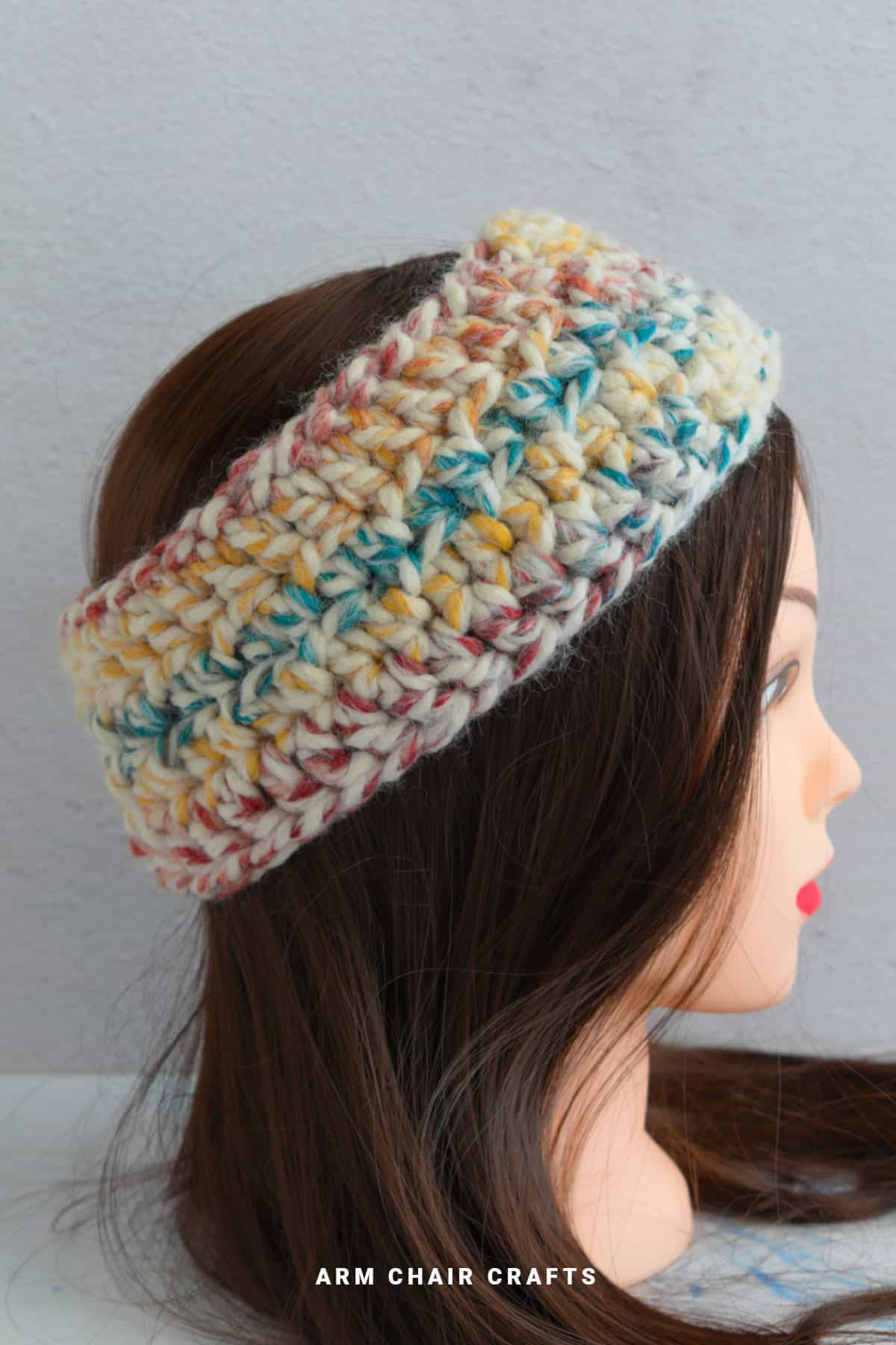 Crochet headband on a mannequin.