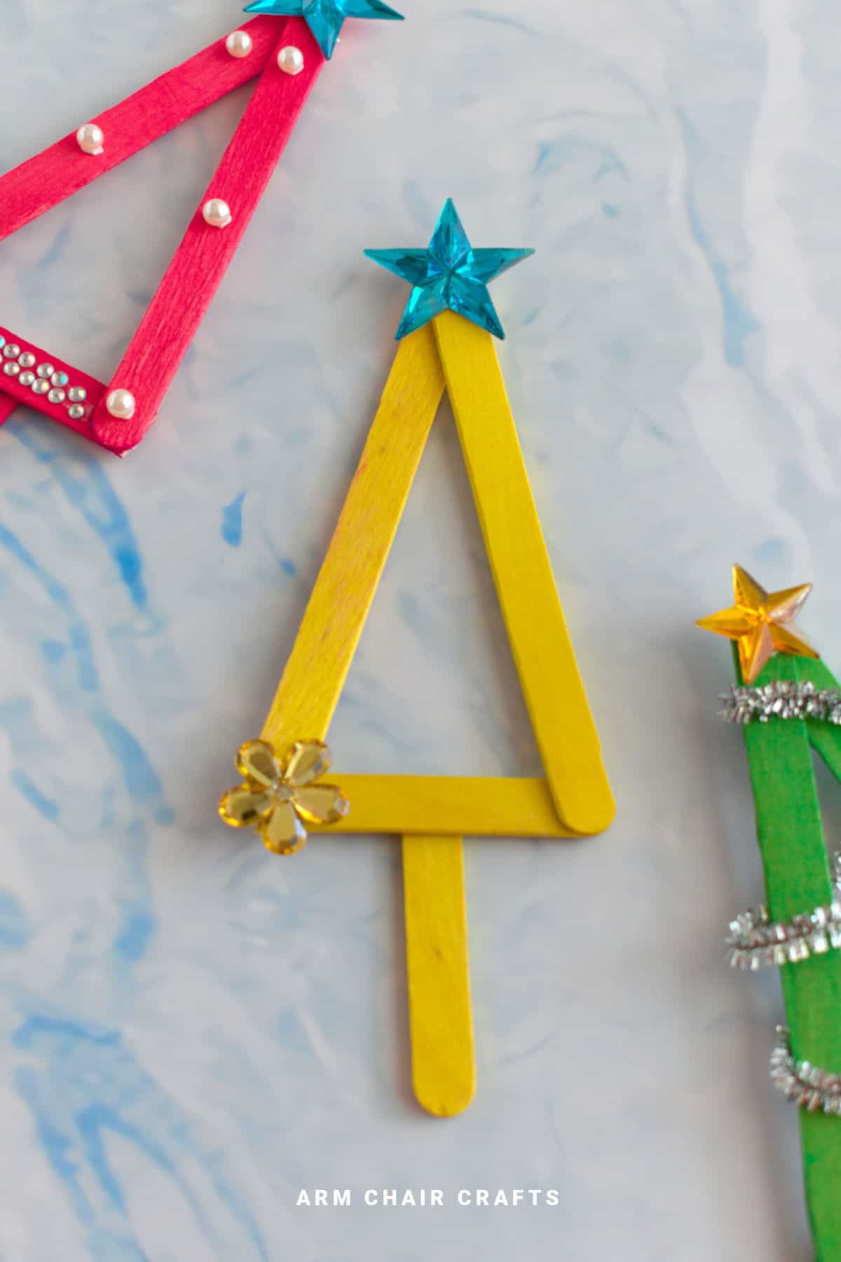 Yellow popsicle Christmas tree ornament.