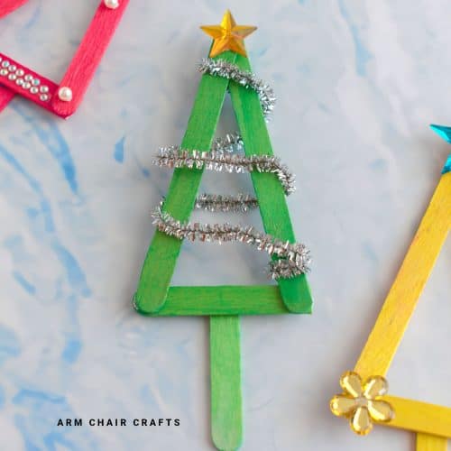 Close up image of a popsicle Christmas tree ornament.