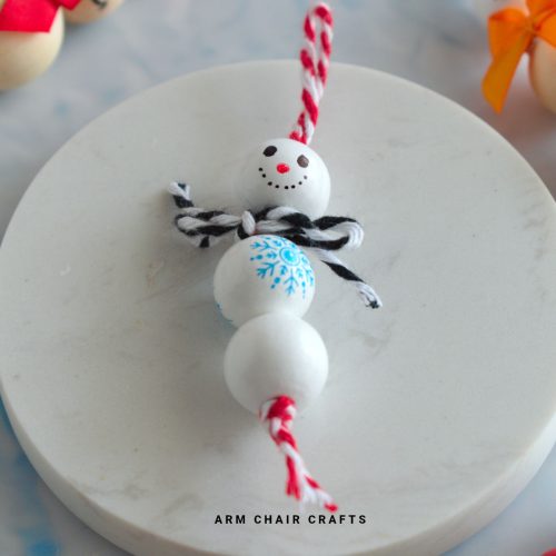 Close up image of a snowman Christmas ornament.
