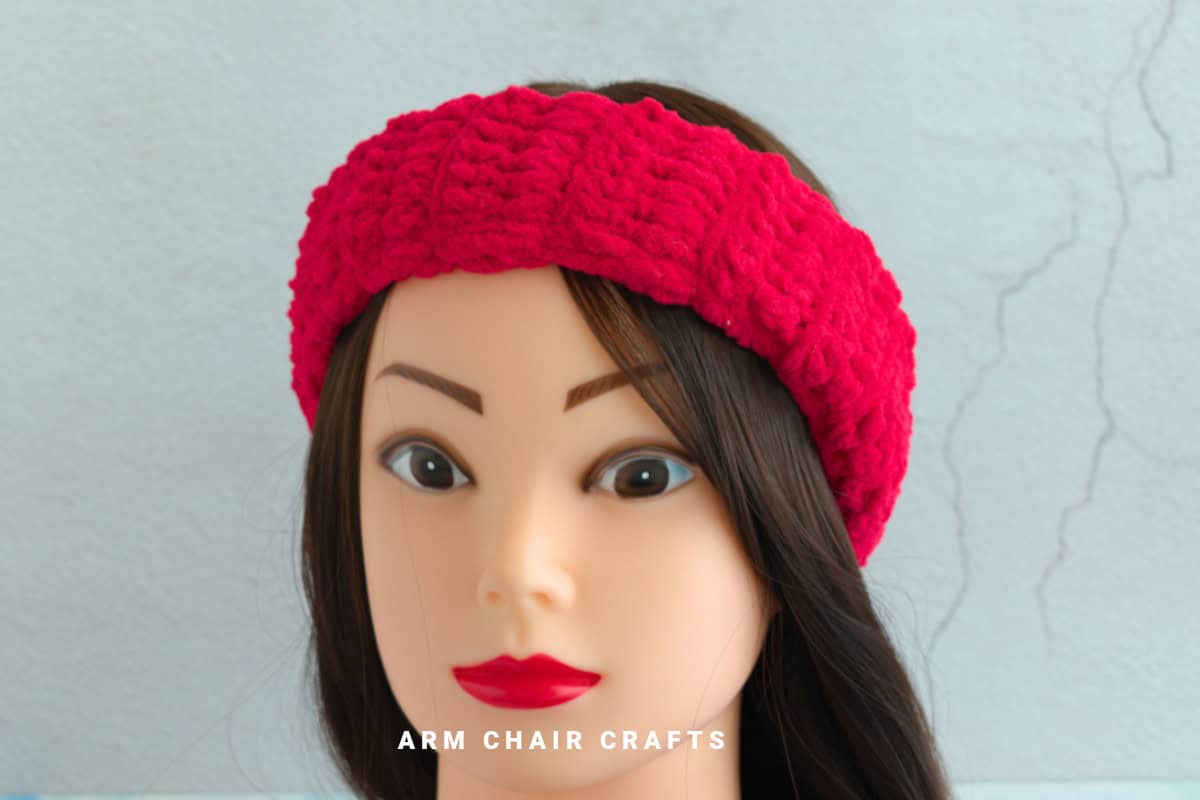 Close up image of a red velvet headband.