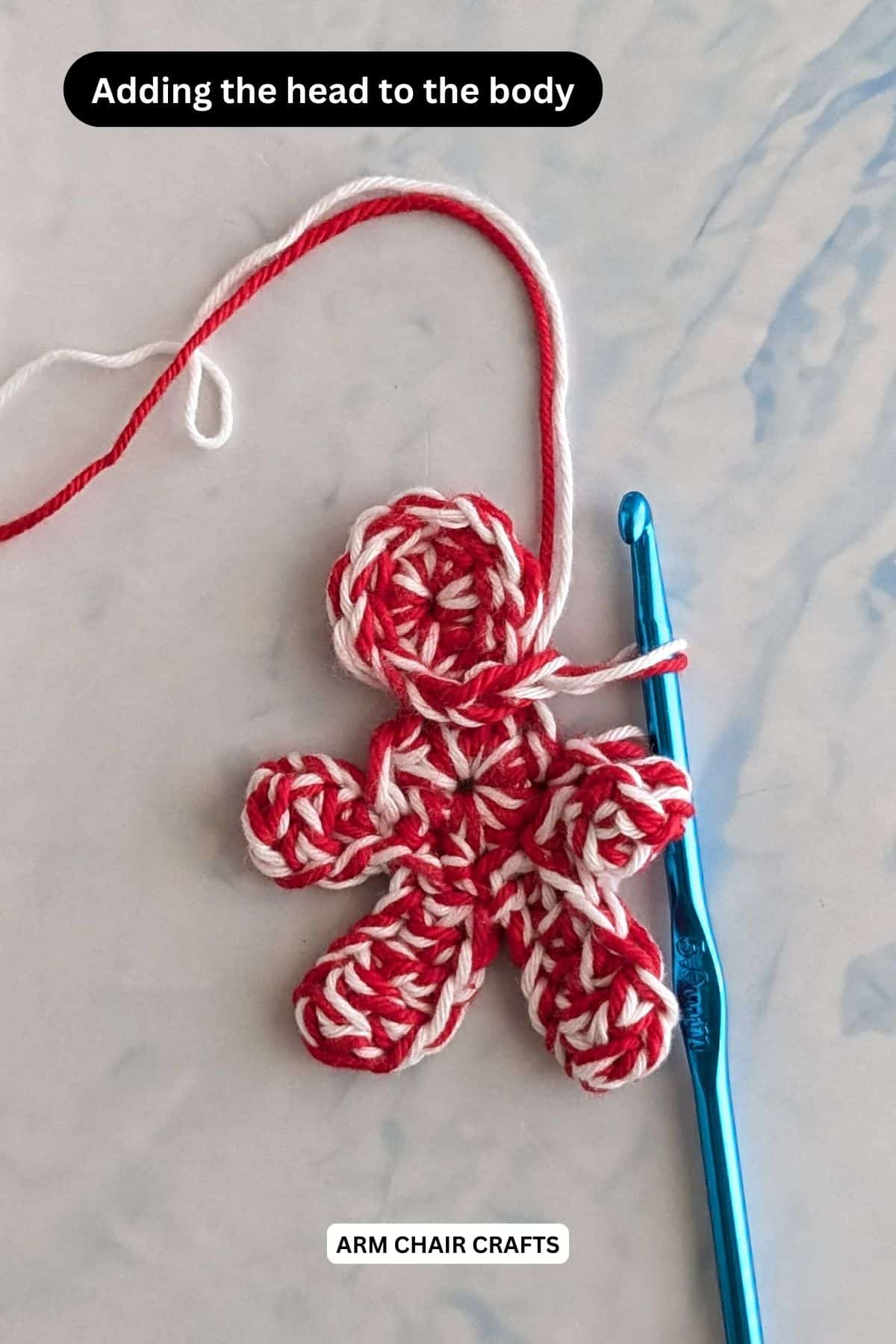 Process of attaching the head to the gingerbread man body.