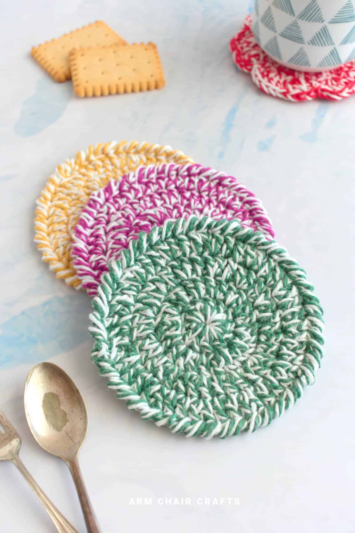 Stack of round crochet coasters.