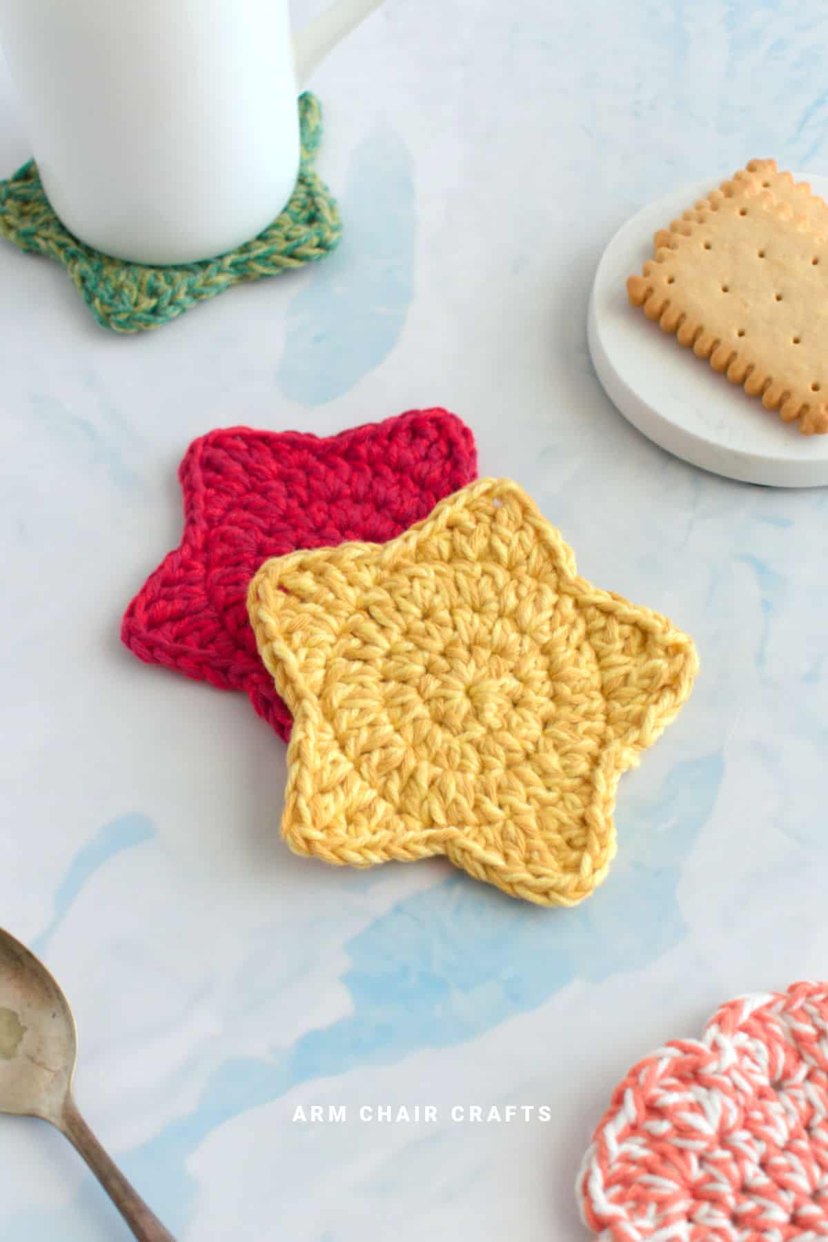 Red and yellow crochet star coasters.