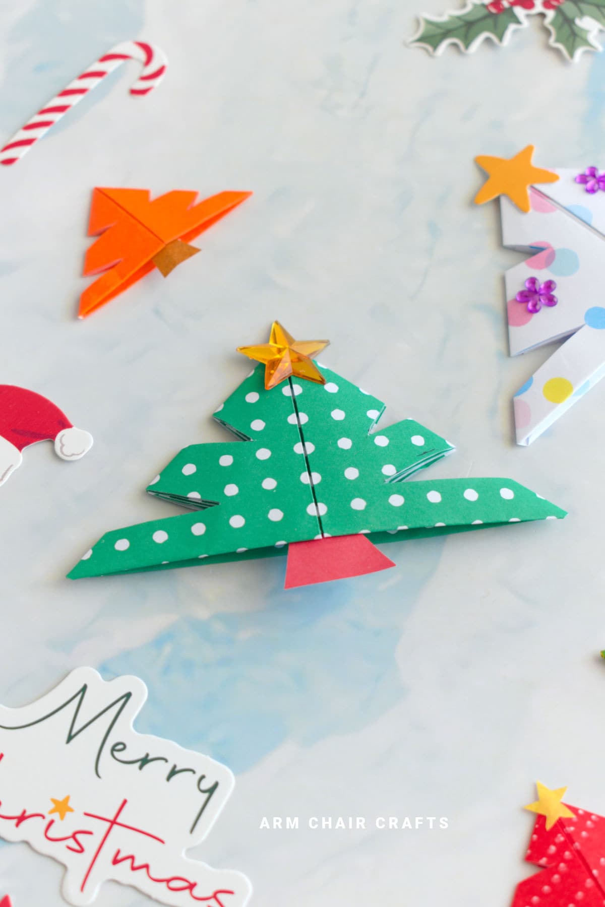 Green and white origami corner bookmark.