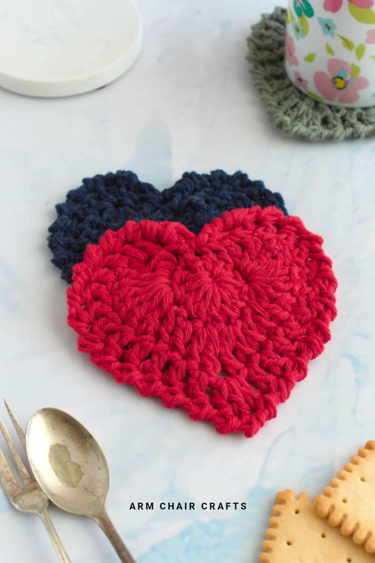 Close up image of crochet heart coasters.
