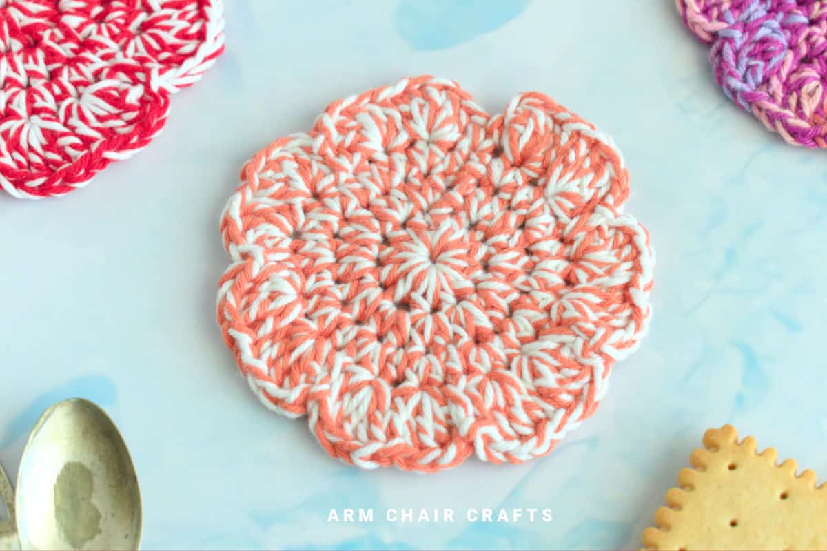 Close up image of a flower crochet coaster.