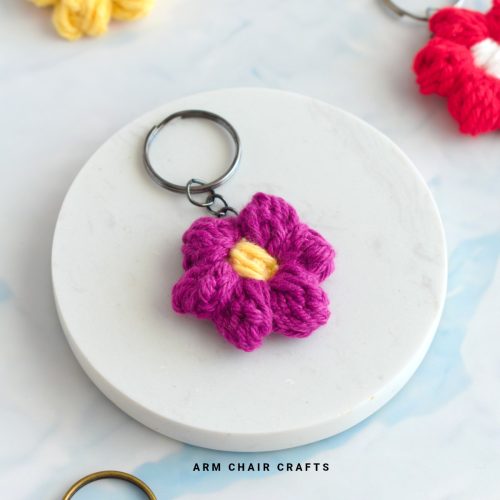 Close up image of a crochet flower keychain.
