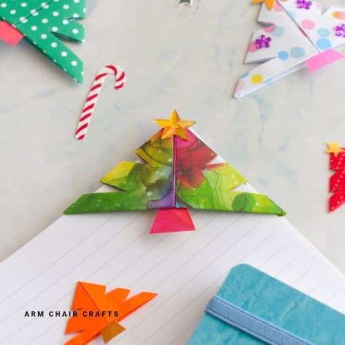 Close up image of a Christmas tree origami corner bookmark.