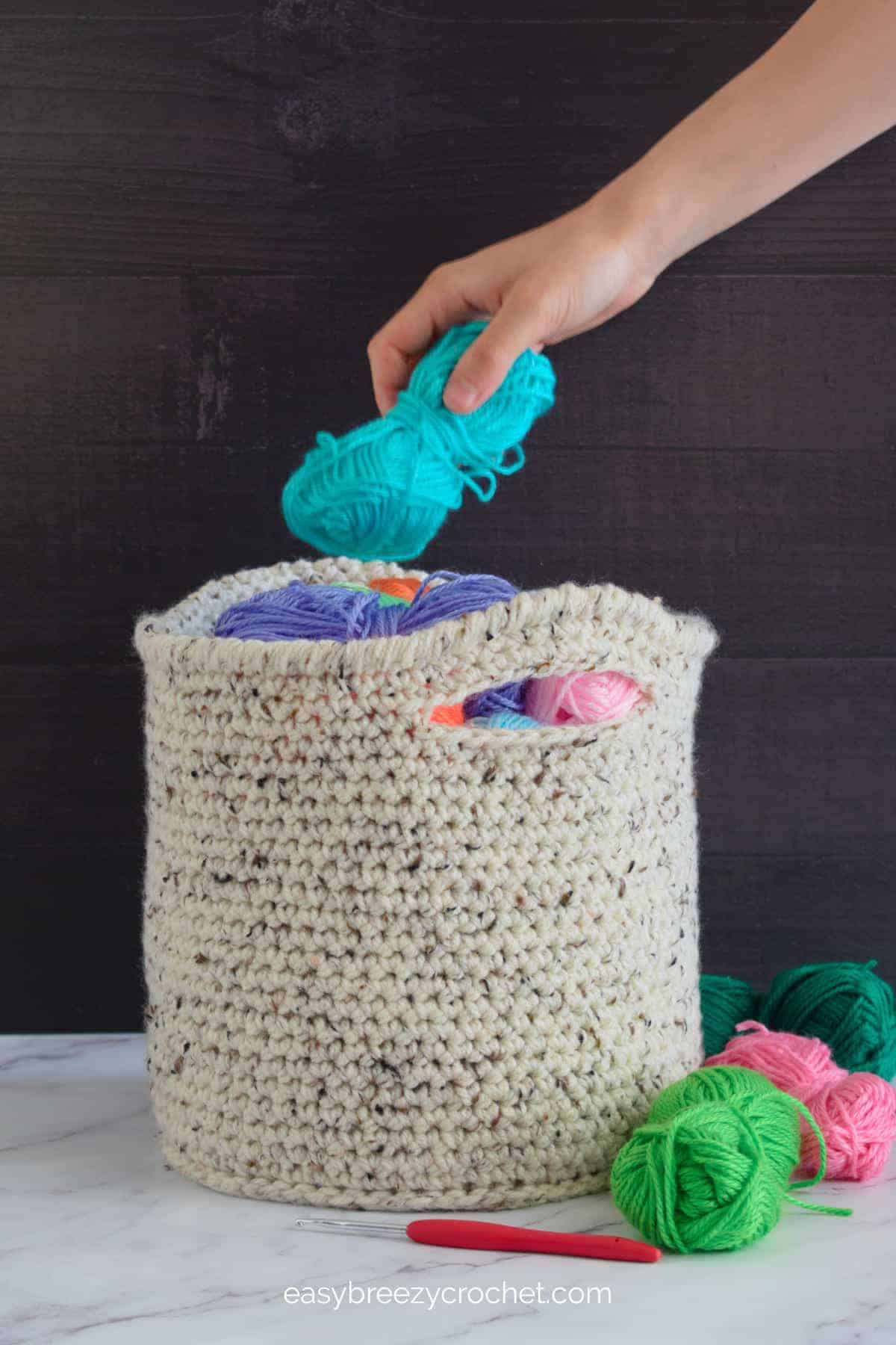 Crochet basket with handles.