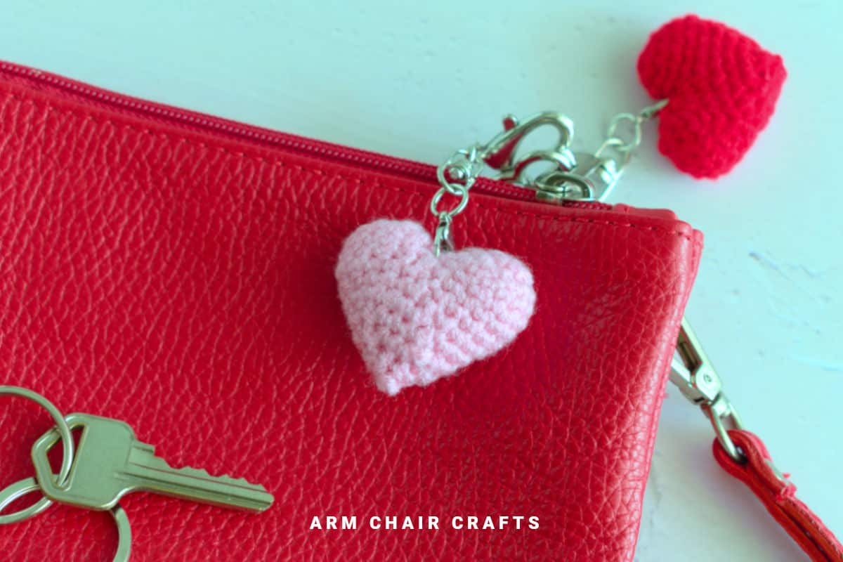 Close up image of a crochet heart keychain.