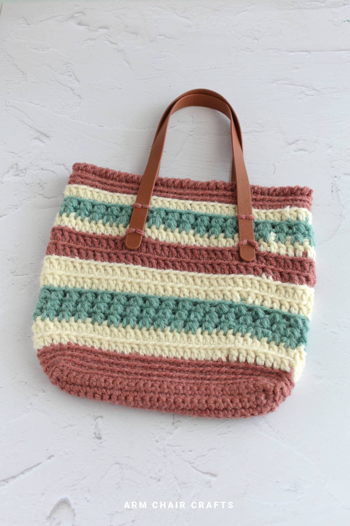 Close up image of a crochet tote bag.