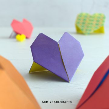 Close up image of a purple origami heart.