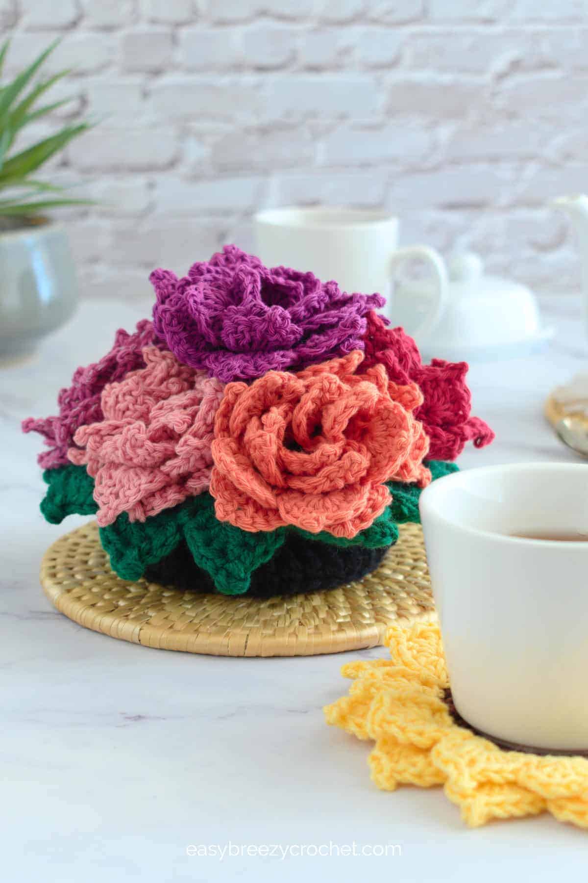 Crochet sunflower coasters in a pot.