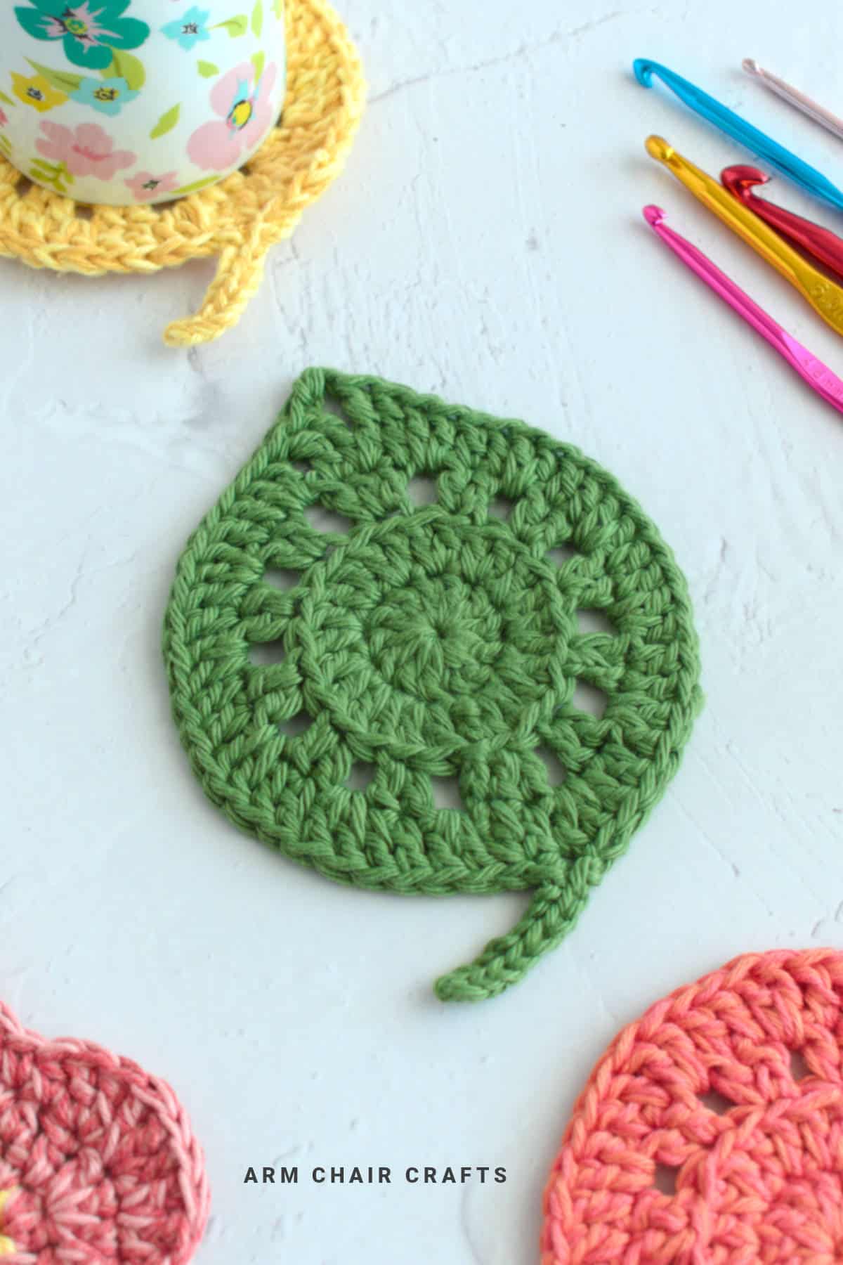 Green leaf crochet coaster.
