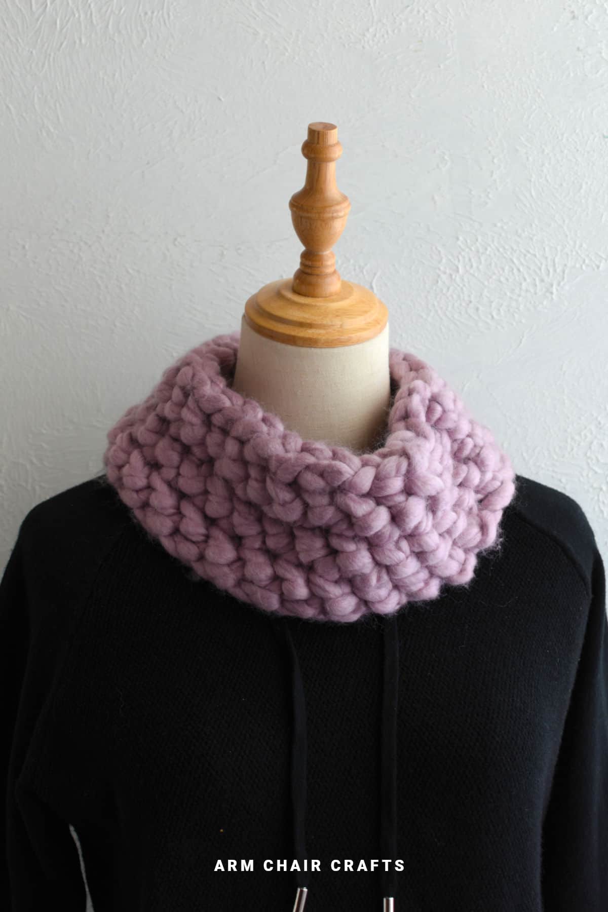 Crochet cowl on a mannequin.
