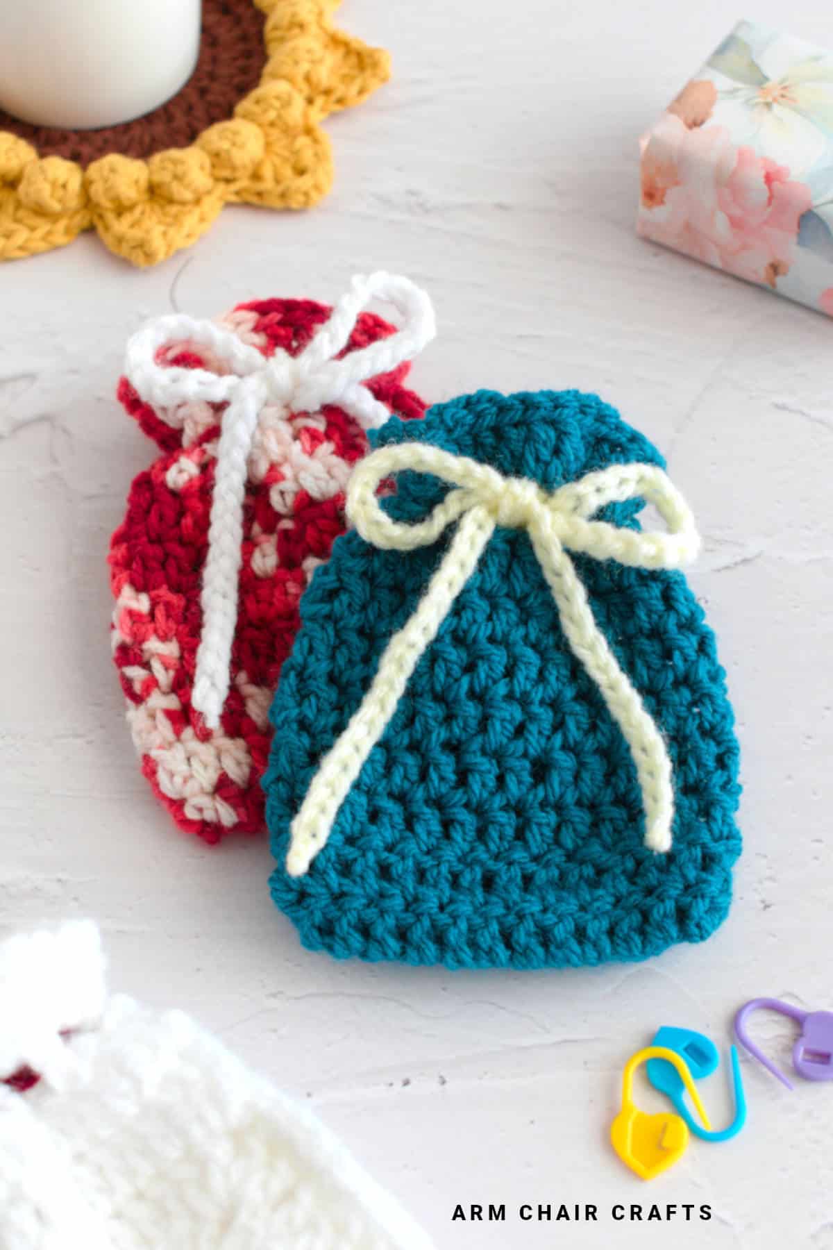 Close up image of crochet drawstring pouches.