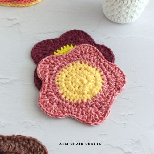 Close up image of crochet flower coasters.