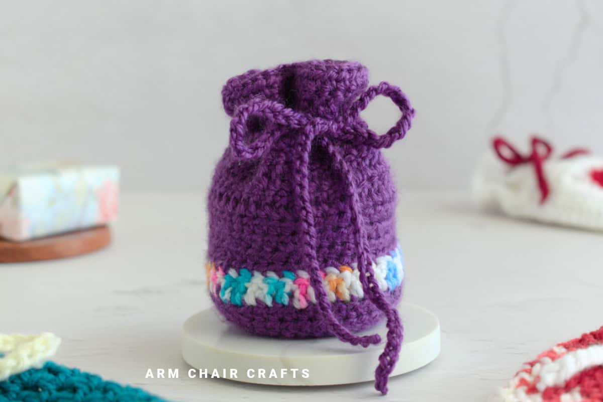 Purple crochet pouch.
