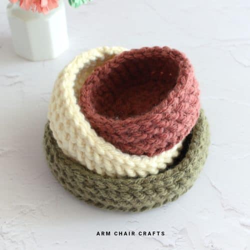 Close up image of a stack of crochet baskets.