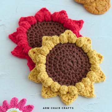 Close up image of sunflower crochet coasters.