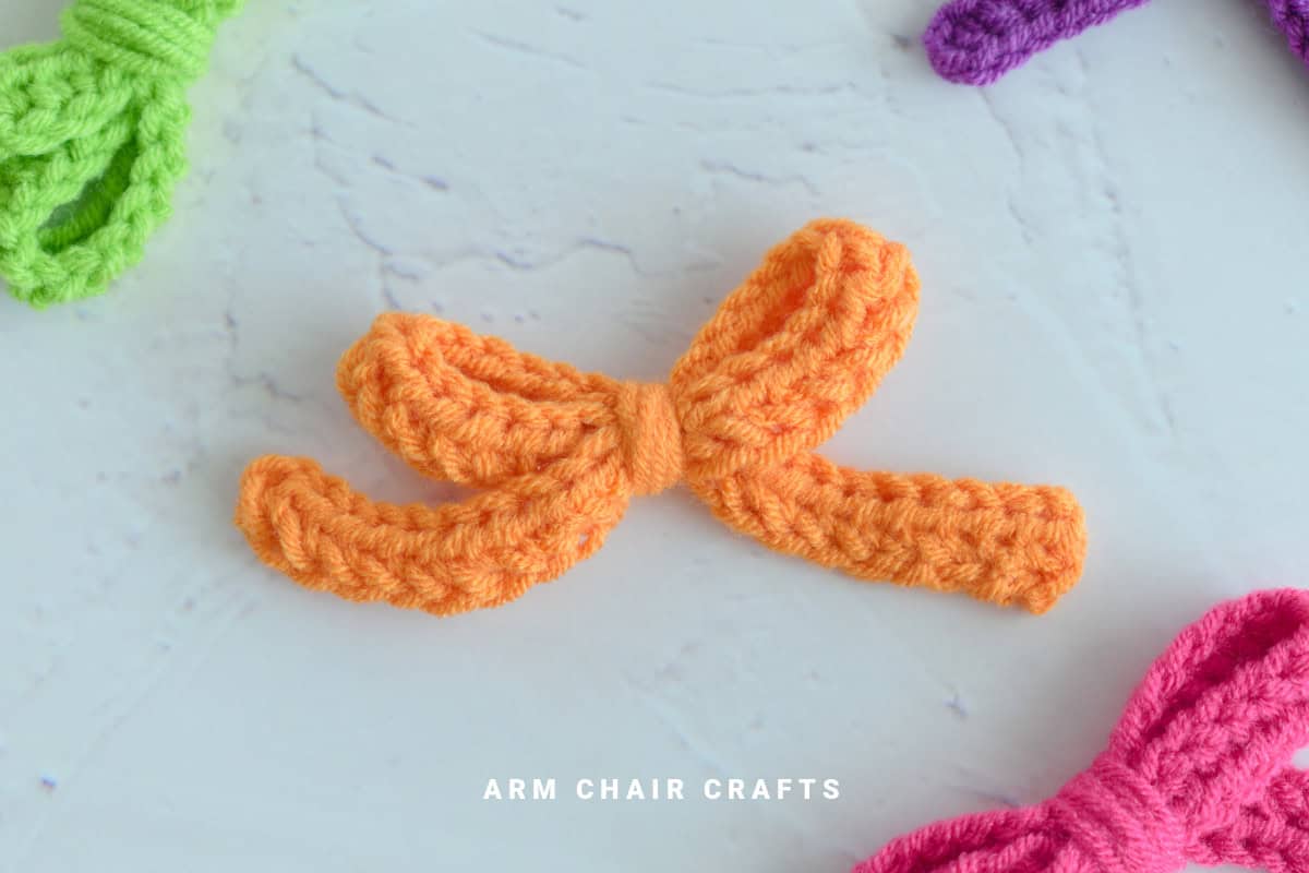 Orange crochet bow.