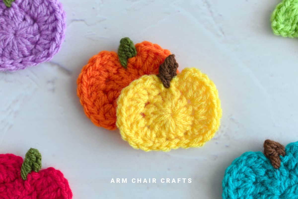 Close up image of crochet pumpkins.