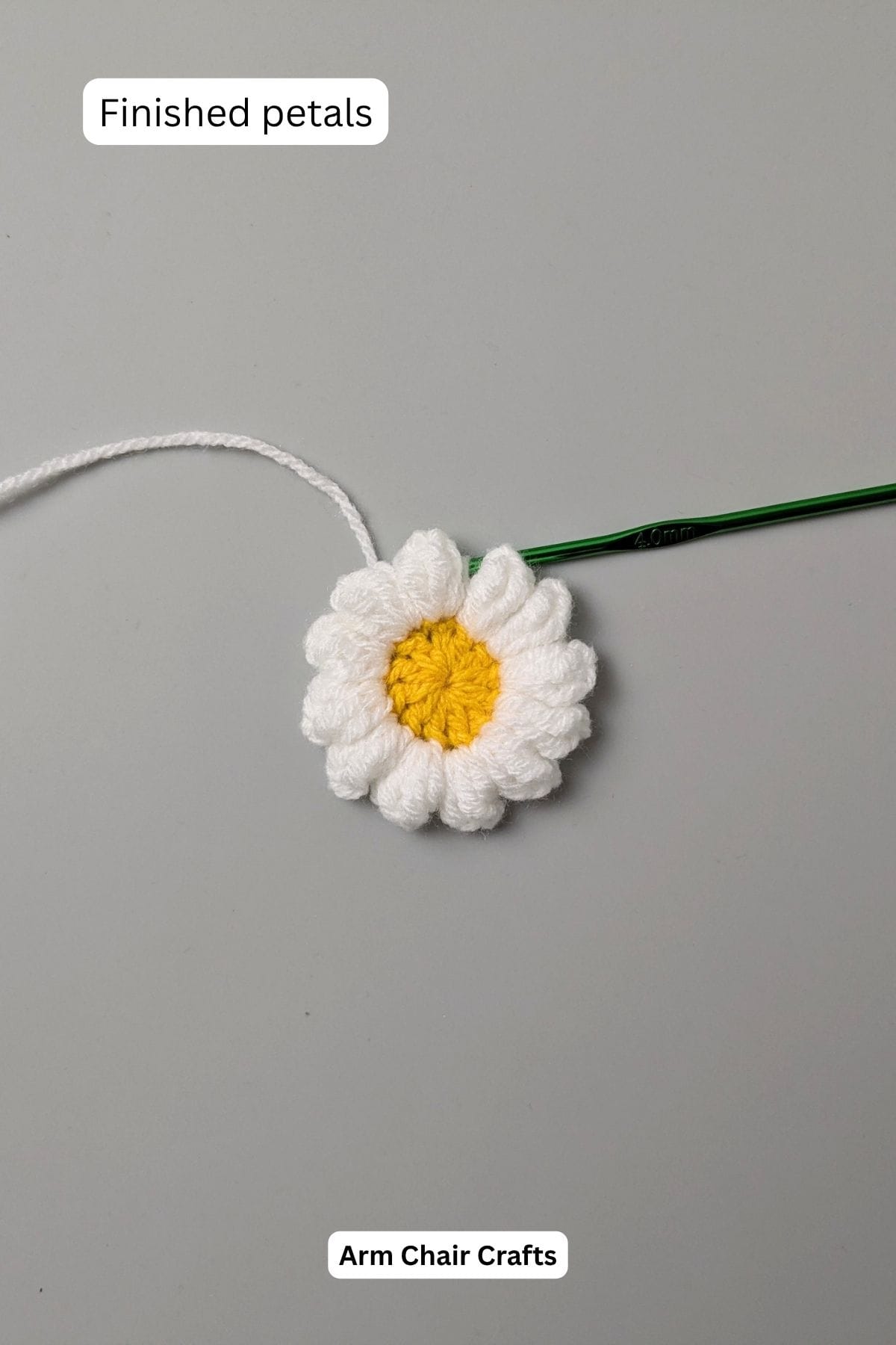 Process of making a daisy crochet keychain.