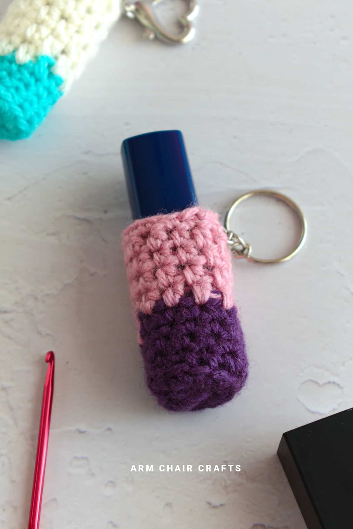 Close up image of a crochet lip balm holder.