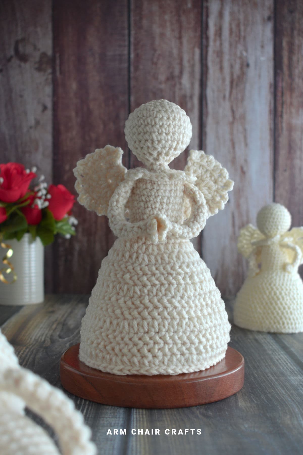 Close up image of a standing crochet angel.