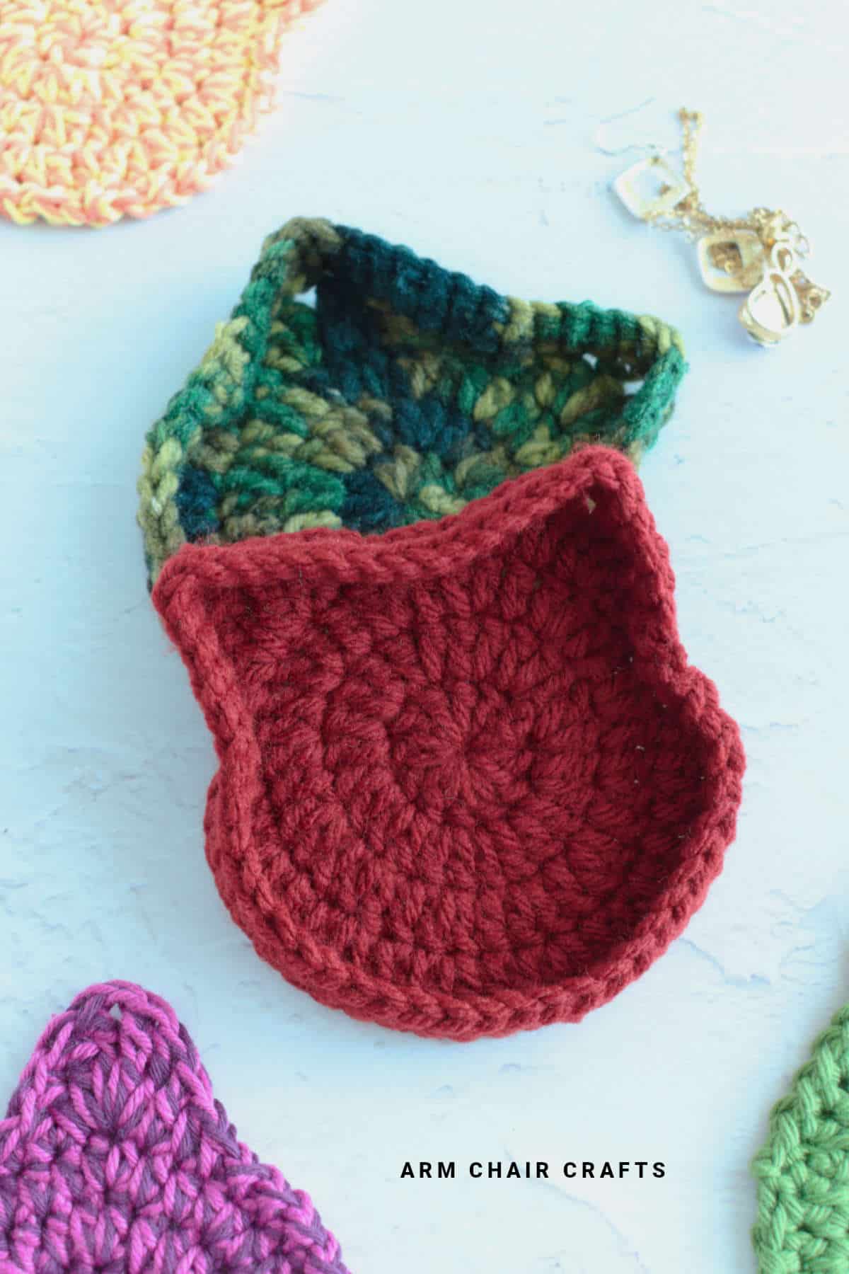 Crochet cat trinket boxes.