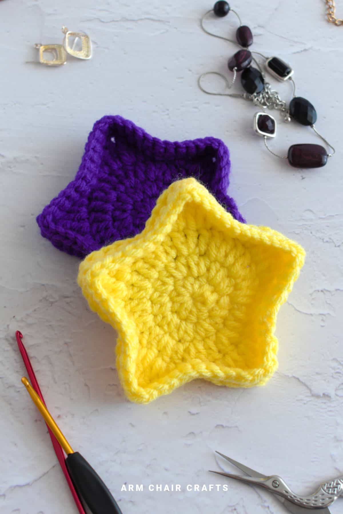 Purple and yellow star crochet trinket boxes.
