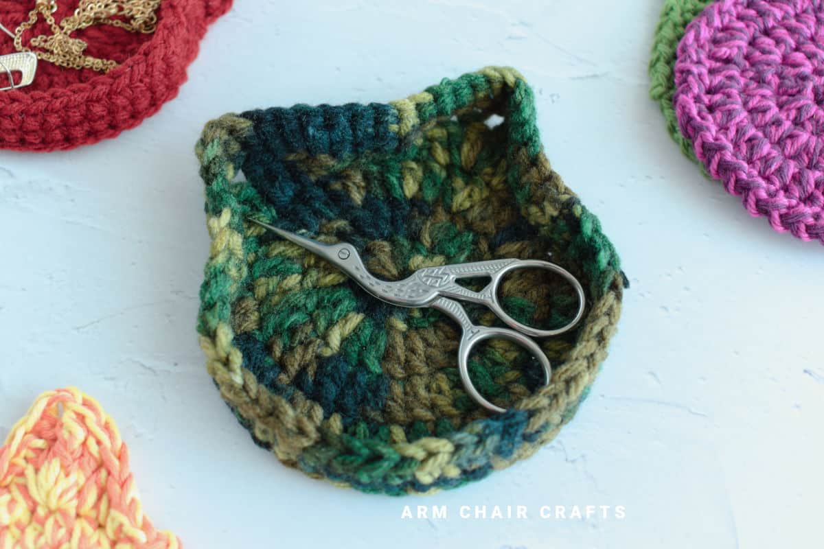 Close up image of cat crochet trinket box.